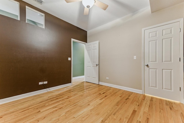 unfurnished room featuring ceiling fan and light hardwood / wood-style floors