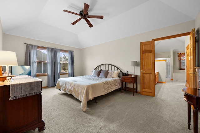 bedroom with lofted ceiling, a ceiling fan, and light carpet