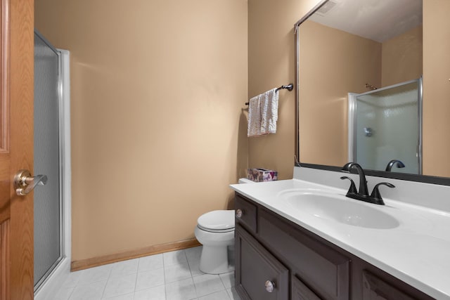 full bath with visible vents, baseboards, toilet, a stall shower, and vanity