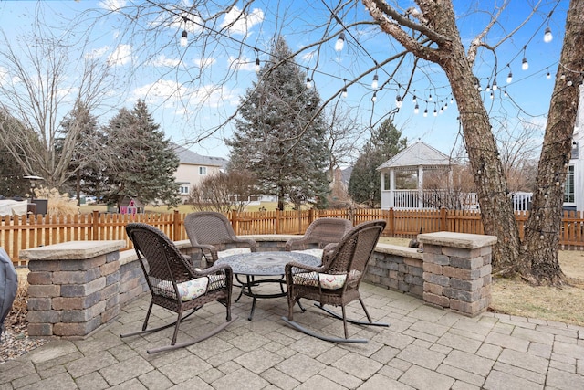 view of patio / terrace with a gazebo and a fenced backyard