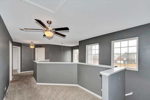 spare room featuring attic access, baseboards, and carpet floors