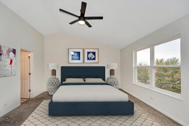 carpeted bedroom with baseboards, a ceiling fan, and vaulted ceiling