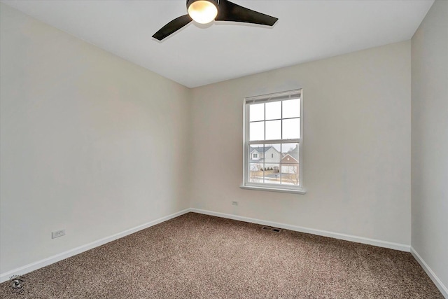 unfurnished room featuring baseboards, ceiling fan, and carpet floors