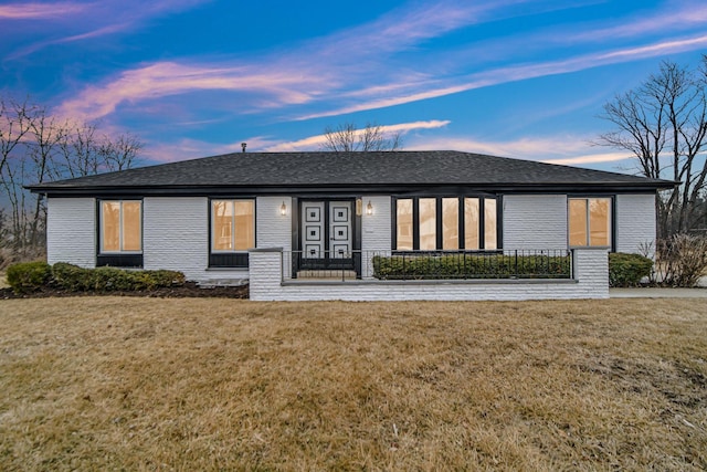 view of front of home with a yard