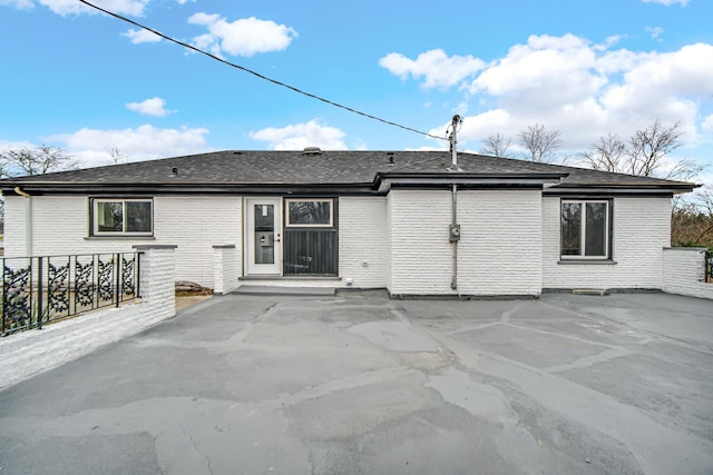 back of property featuring a patio area