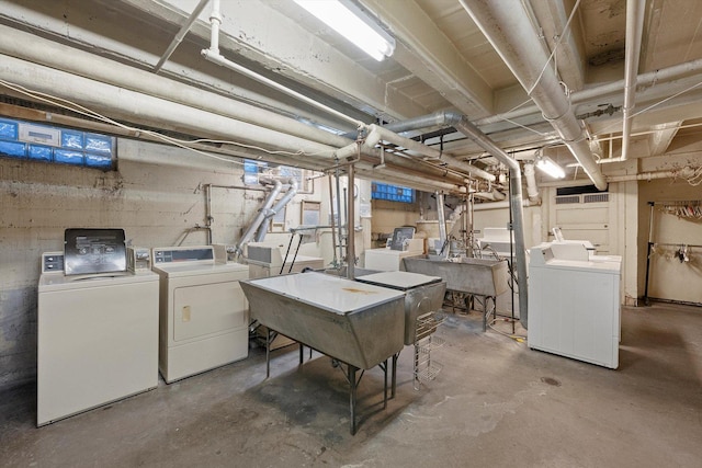 unfinished below grade area featuring a sink and washer and dryer