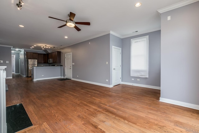 unfurnished living room with hardwood / wood-style flooring, ceiling fan, and ornamental molding