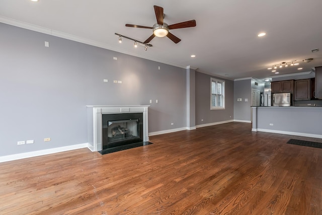 unfurnished living room with hardwood / wood-style flooring, crown molding, rail lighting, and ceiling fan