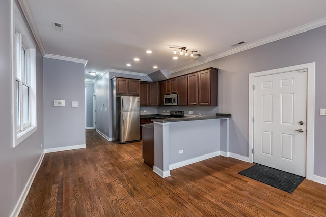 kitchen featuring dark brown cabinetry, crown molding, dark hardwood / wood-style flooring, kitchen peninsula, and stainless steel appliances