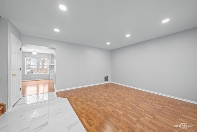 unfurnished room with light hardwood / wood-style floors