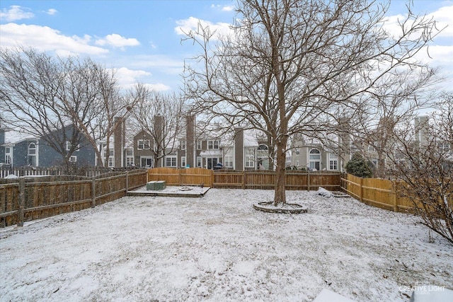 view of yard layered in snow