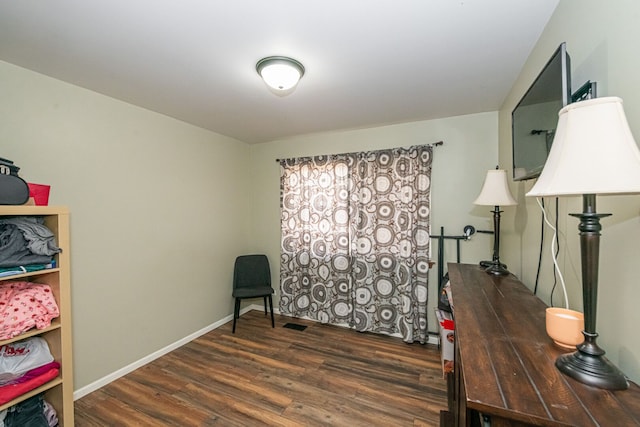 office area with wood finished floors and baseboards