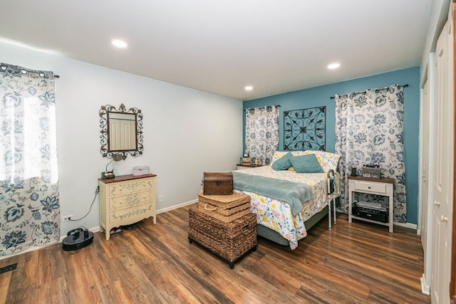 bedroom with recessed lighting, wood finished floors, and baseboards