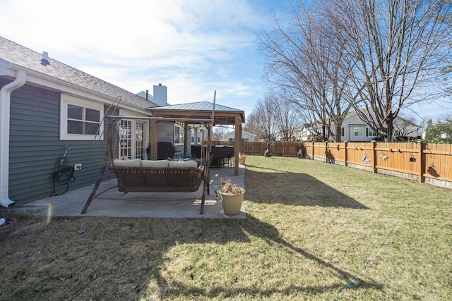 view of yard featuring a patio, a fenced backyard, and an outdoor hangout area