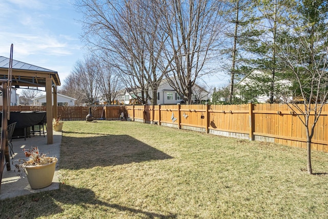 view of yard featuring a gazebo, a fenced backyard, and a patio area