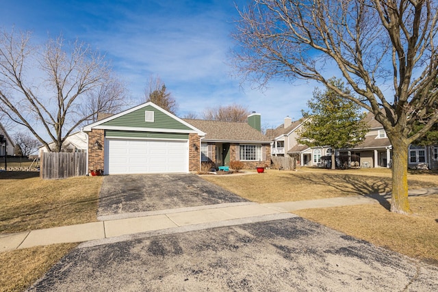 ranch-style house with fence, a chimney, a garage, aphalt driveway, and brick siding