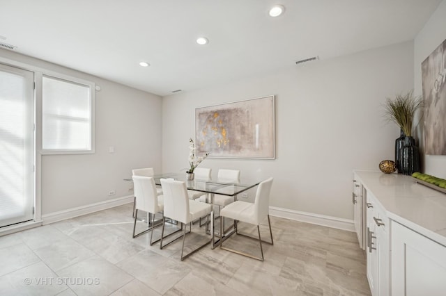 dining area with baseboards, visible vents, and recessed lighting