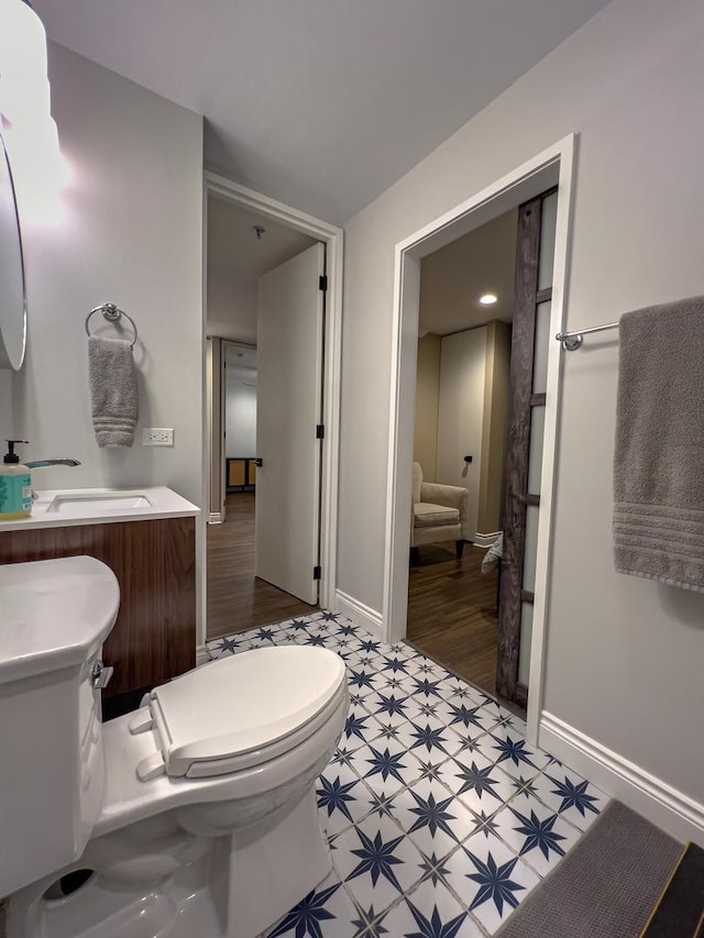 bathroom with vanity and toilet