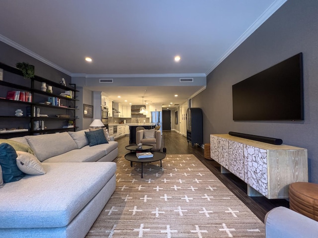 living room featuring crown molding and wood-type flooring