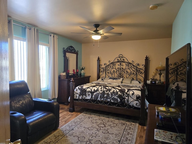 bedroom with hardwood / wood-style flooring and ceiling fan