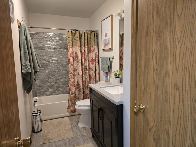 full bathroom featuring toilet, vanity, and shower / bathtub combination with curtain