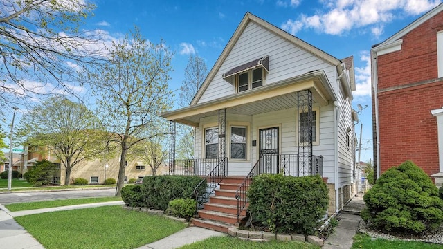 view of front of home featuring a porch and a front yard