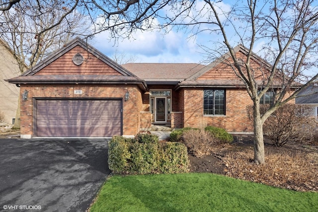 single story home with aphalt driveway, brick siding, an attached garage, and roof with shingles