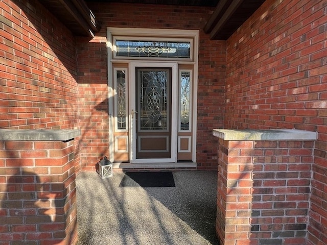 entrance to property with brick siding