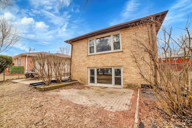 back of house with a patio area