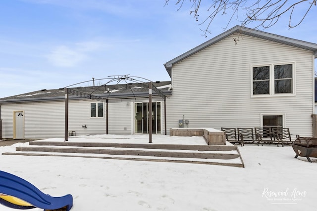 snow covered house featuring a gazebo