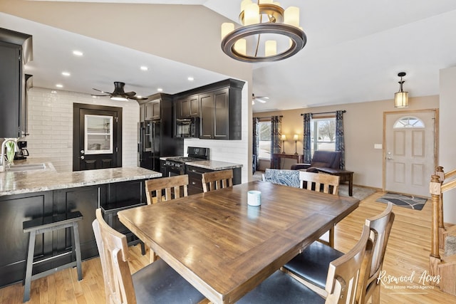 dining room featuring recessed lighting, lofted ceiling, light wood-style floors, and ceiling fan