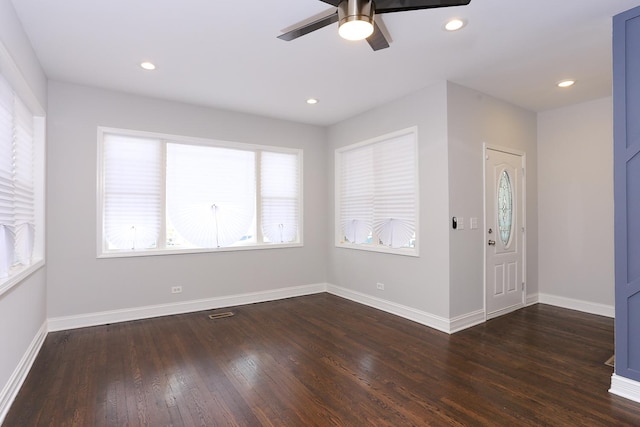 entryway with ceiling fan and dark hardwood / wood-style flooring