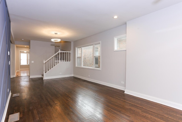 unfurnished room featuring dark wood-type flooring