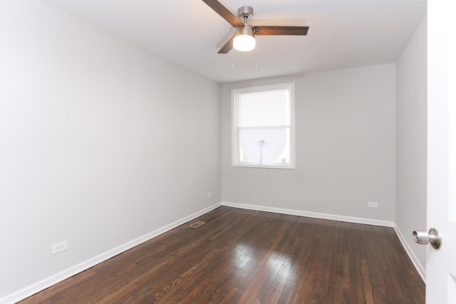 empty room featuring ceiling fan and dark hardwood / wood-style flooring