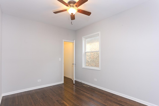 unfurnished room featuring ceiling fan and dark hardwood / wood-style flooring