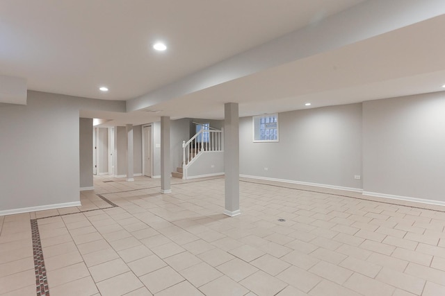 basement with light tile patterned flooring