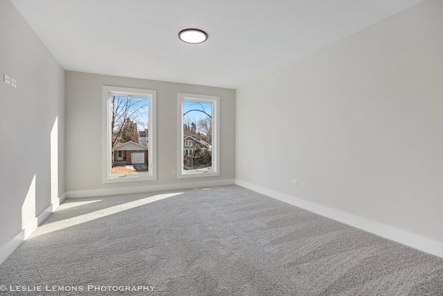 unfurnished room with carpet floors