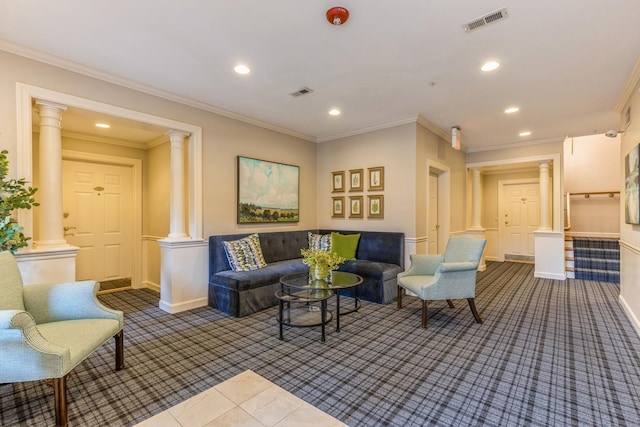 living room featuring dark carpet, ornamental molding, and decorative columns