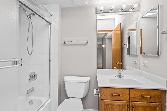 full bathroom with shower / bath combination with glass door, vanity, and toilet