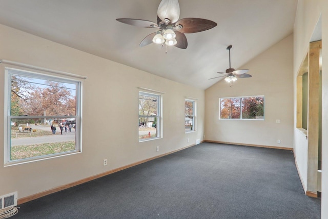 carpeted empty room featuring ceiling fan and lofted ceiling