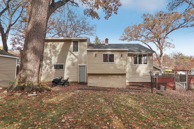 rear view of property with a yard