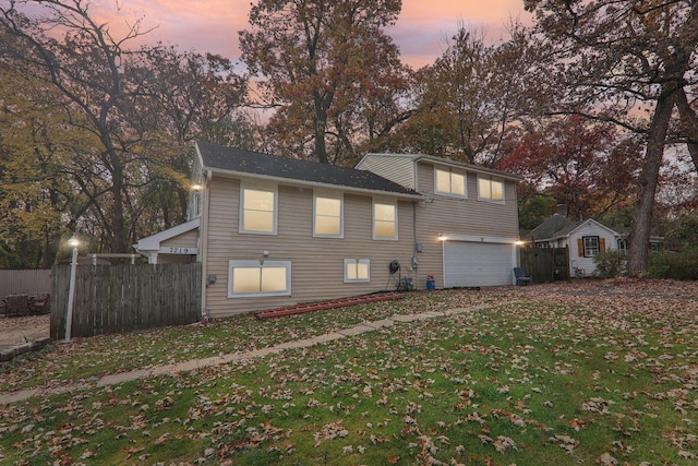 exterior space with a garage and a yard