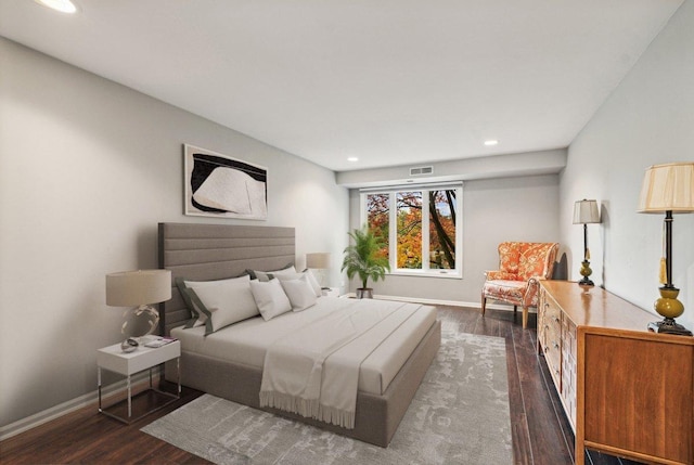 bedroom featuring dark hardwood / wood-style flooring