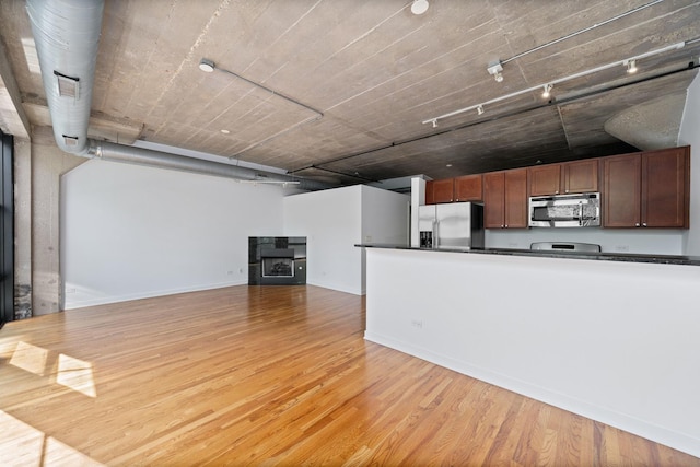 1150 W 15th St Unit 232, Chicago, IL 60608 - kitchen with appliances with stainless steel finishes and light hardwood / wood-style flooring