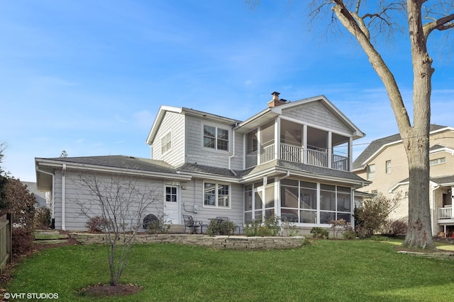 267 Merton Ave, Glen Ellyn, IL 60137 - back of property featuring a balcony, a sunroom, a lawn, and a chimney