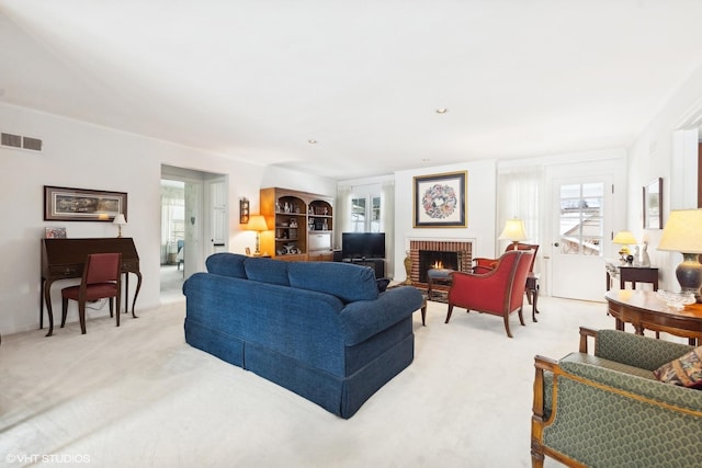 267 Merton Ave, Glen Ellyn, IL 60137 - living area featuring plenty of natural light, light colored carpet, and a brick fireplace