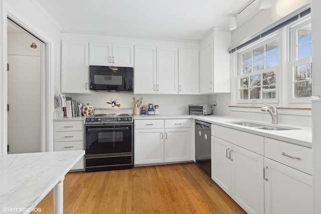 267 Merton Ave, Glen Ellyn, IL 60137 - kitchen featuring black microwave, electric stove, a sink, stainless steel dishwasher, and white cabinetry