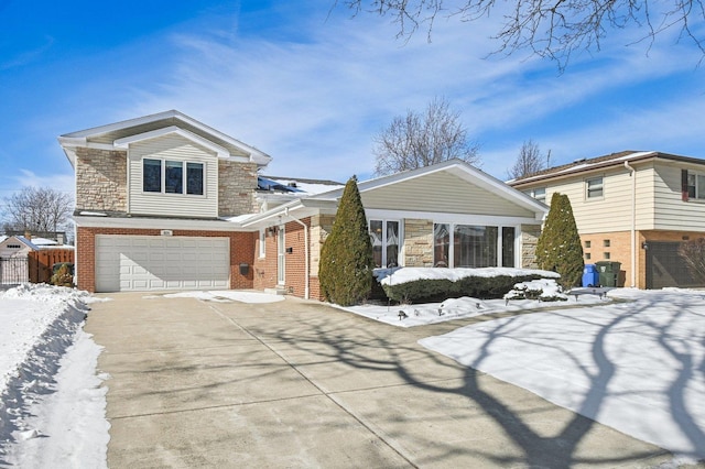 view of front of house with a garage, stone siding, concrete driveway, and brick siding