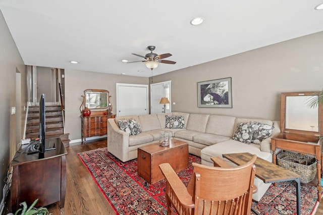 living area featuring dark wood-style floors, recessed lighting, stairway, ceiling fan, and baseboards