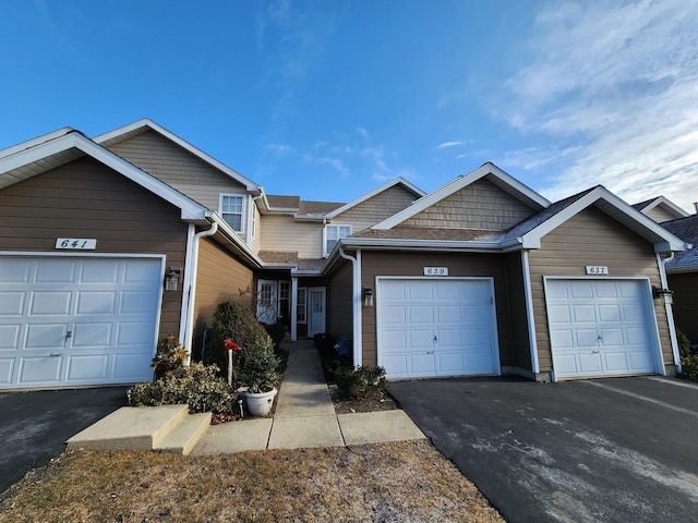 view of front of property featuring driveway and a garage